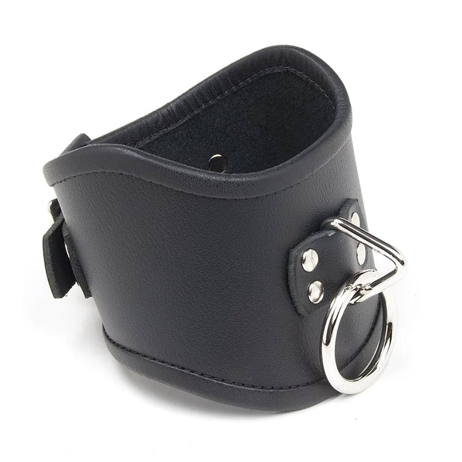 The Tall Curved Posture Collar With A Locking Buckle is shown against a blank background. It is made of black leather with silver hardware and has a D-ring in the front with an O-ring hanging off of it. The collar has a slight dip at the top in the front.