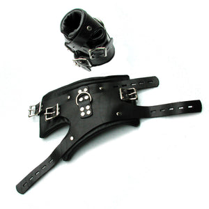 A pair of BDSM Deluxe Suspension Leather Cuffs are shown against a blank background, one cuffed and one uncuffed. The black leather cuffs have a metal D-ring, three adjustable straps, and buckles.