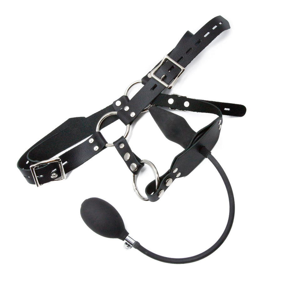 The black leather Inflatable Anal Plug Harness for Men is displayed against a blank background. It has a waistband with two buckling straps and a strap that goes between the legs, with a wider piece of leather that holds the inflatable plug.