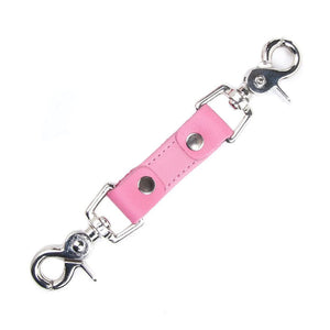 The pink Premium Garment Leather Restraint Clip is displayed against a blank background. It is a short piece of light pink leather with silver metal rivets and a metal snap hook on each end.