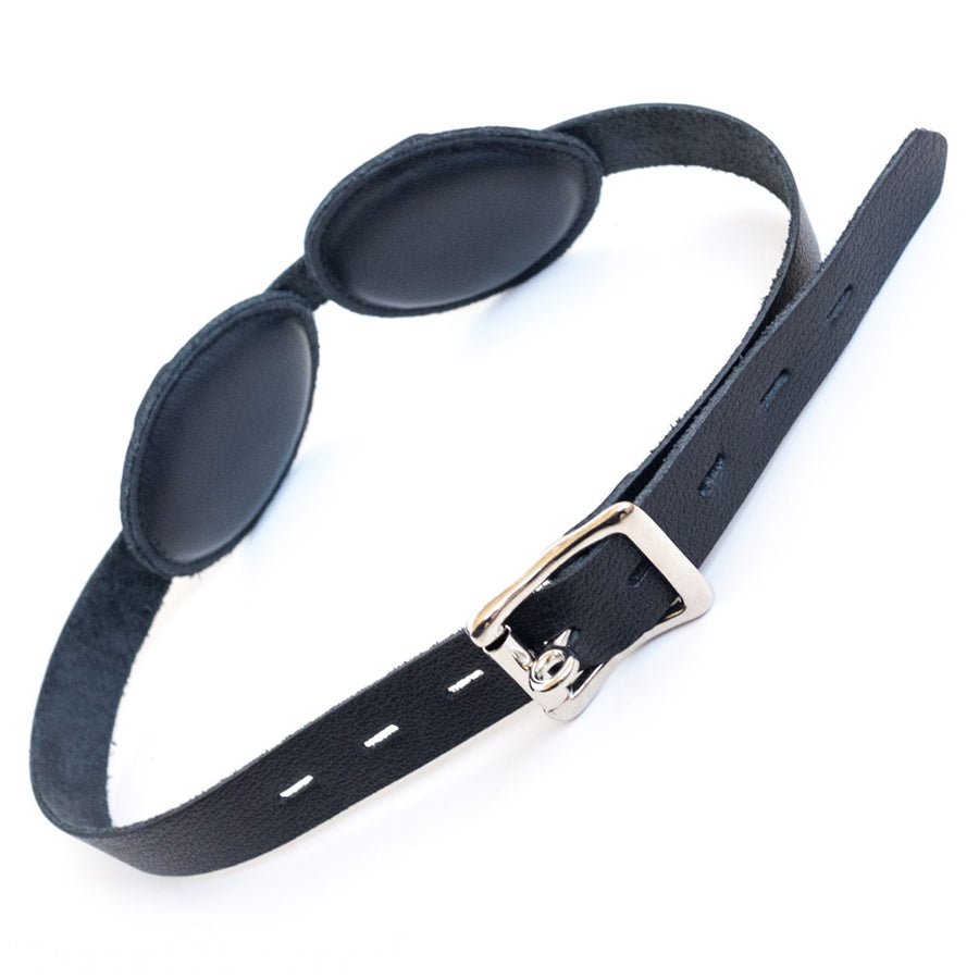 The back of the Foam Padded Aviator Blindfold is displayed against a black background. The strap is adjustable and secured by a metal buckle.