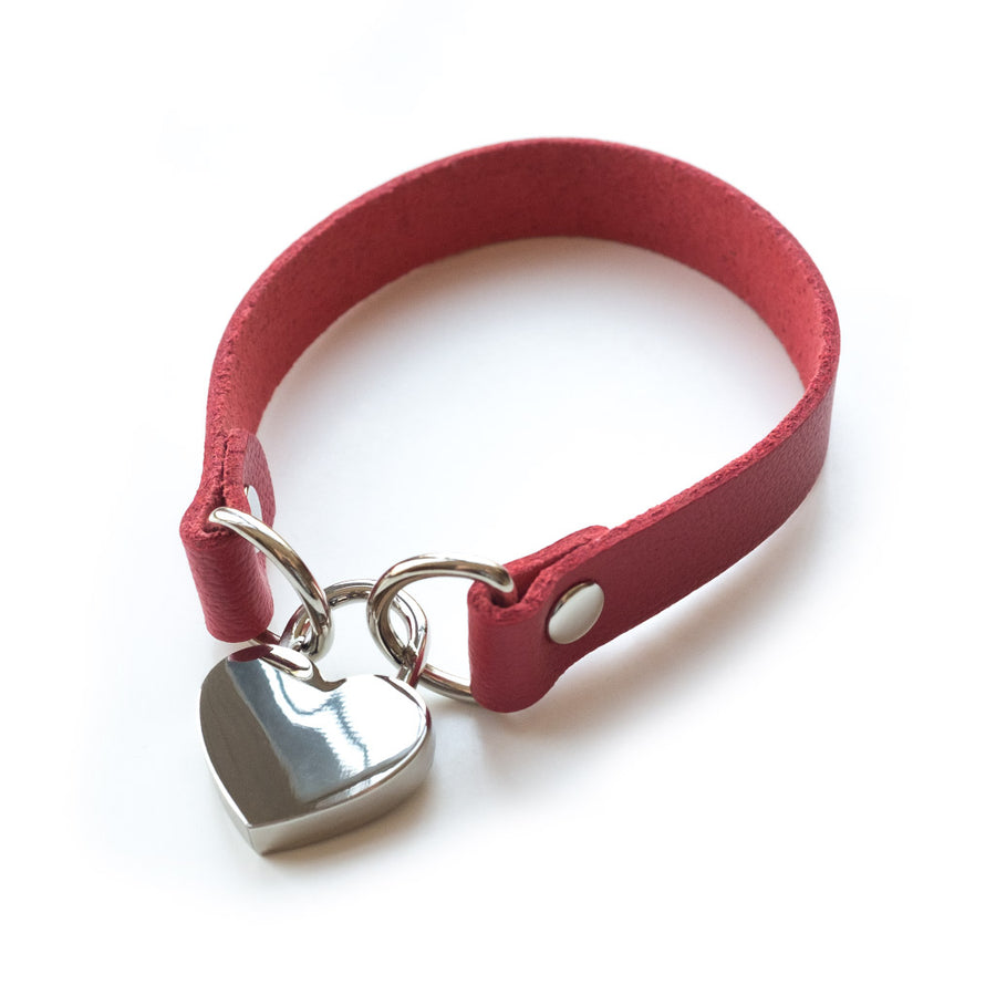 The red Heart Lock Choker is shown against a blank background.