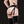Load image into Gallery viewer, The back of a woman’s body is shown from her back to her knees against a black background. She wears black latex stockings and gloves and the Nancy Strapon Harness with a black dildo attached. The harness frames her ass, leaving it exposed.
