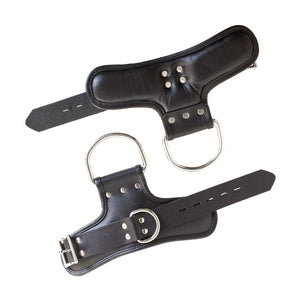 A pair of unbuckled Padded Suspension Cuffs are displayed against a blank background.