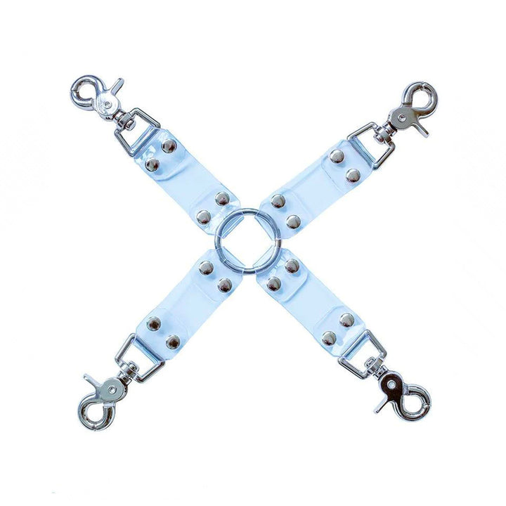 The Clear CTRL Vinyl Hog Tie is shown against a blank background. It is four strips of transparent vinyl arranged in the shape of an X with a metal O-ring in the center. Each strip has a snap hook at the end.