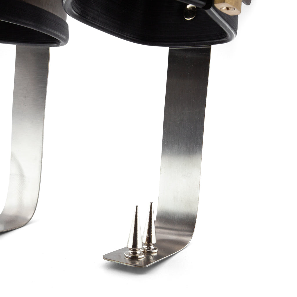 Close-up of the two spikes which will stab the heel if the wearer brings their foot down. 