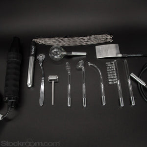 The contents of the Kinklab Agent Noir™ Neon Wand Electrosex Kit are shown against a black background. The wand is shown alongside the ten attachments from the kit.