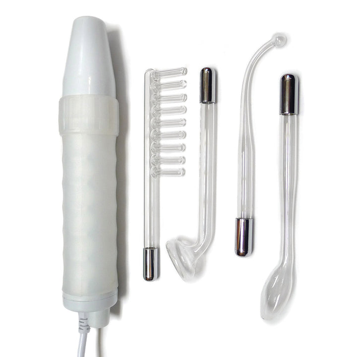 The contents of the Kinklab Neon Wand® Electrosex Kit are laid out on a blank background. Shown are the white neon wand base and the comb, mushroom tube, 90° Probe, and tongue tube. The attachments are all clear with metal bases.