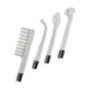 The attachments from the Kinklab Neon Wand® Electrosex Kit are shown against a blank background. The electrode comb attachment looks like a comb. The mushroom electrode has a flat circle. The 90° Probe has a small ball. The tongue tube has an ovular end.