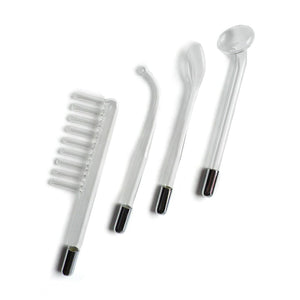 The attachments for the Kinklab Neon Wand® Electrosex Kit are shown against a blank background. The Electrode Comb resembles a comb; the 90° Probe is bent at the top with a small point; the Tongue Tube has an ovular tip; the Mushroom Tube has a flat circular tip.