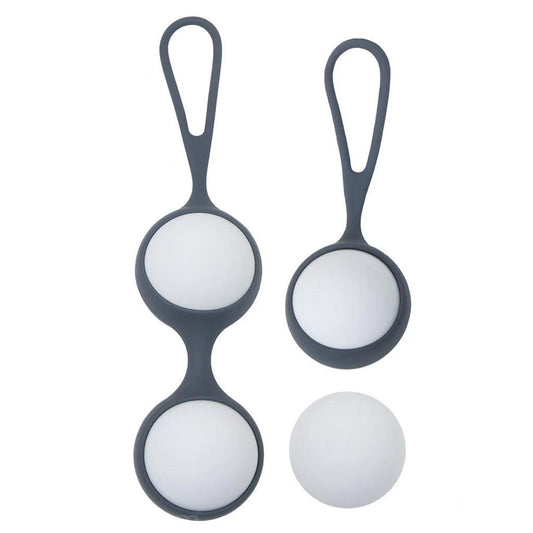The KinkLab Private Pursuit Kegel Balls are displayed against a blank background. The set comes with two different silicone cases, each with loops on the end. One case holds one ball, and the other holds two. 