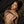 Load image into Gallery viewer, A nude woman with brown hair is lying down on a black leather sheet. She is holding the Kinklab Innuendo Anal Beads across her chest. There are seven beads, graduating in size, made of black silicone. There is an O-ring at the base of the beads.
