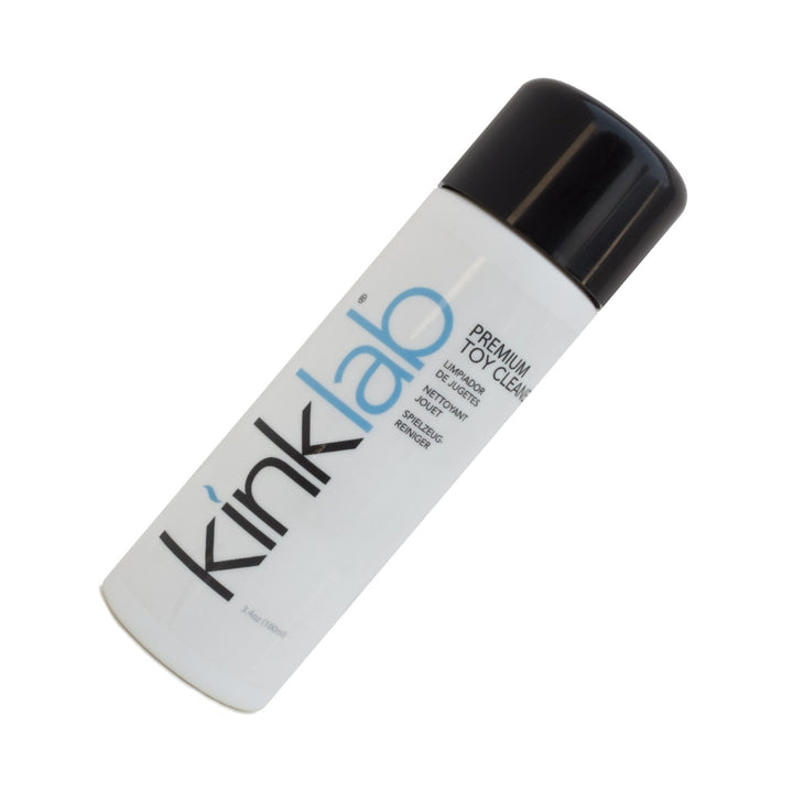 A bottle of KinkLab Premium Toy Cleaner is displayed against a blank background. The bottle is white with the KinkLab logo on it with a black cap.