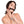 Load image into Gallery viewer, A woman with shoulder-length curly dark hair is shown against a blank background, wearing the Kinklab Silicone Bit Gag With A Leather Strap. Her nails are painted red, and her hands rest on her face below the gag. The gag is a rod made of black silicone.
