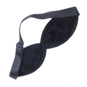 The Adjustable Blindfold is shown from the back against a blank background. The inside of the blindfold is lined with black faux fur, and it has an adjustable black fabric strap.