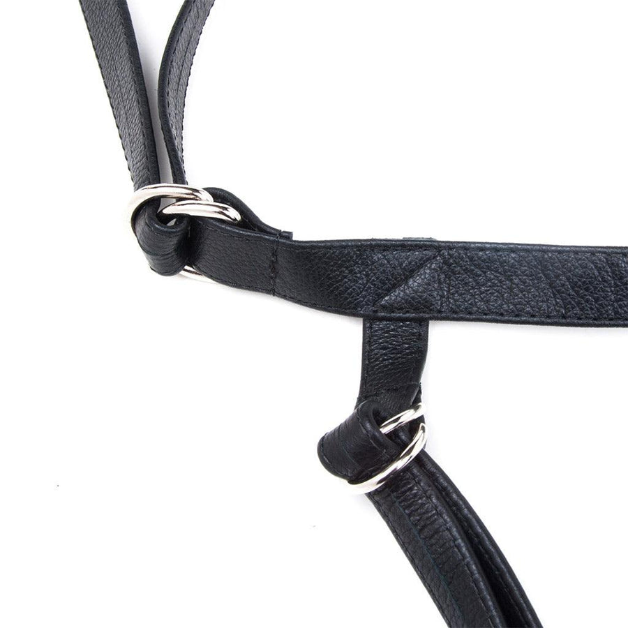 A close-up of the straps of the Texas Two-Strap strap-on harness is shown against a blank background.