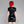 Load image into Gallery viewer, A woman with bright red hair poses in front of a grey backdrop facing away from the camera. She wears the Latex Sweetheart Dress with Short Sleeves by Syren Latex in black. The dress has a zipper up the back.
