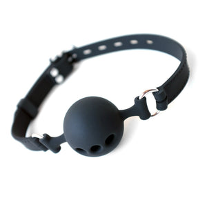The Silicone Breathable Ball Gag is shown against a blank background. The ball gag has three holes for air flow in the front, and it is attached with silver metal hardware to two black silicone straps, which buckle in the back.