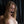 Load image into Gallery viewer, A nude woman with dirty blonde hair is shown standing against a black background and has the Silicone Breathable Ball Gag in her mouth. Drool is dripping out of her mouth and onto her chest.
