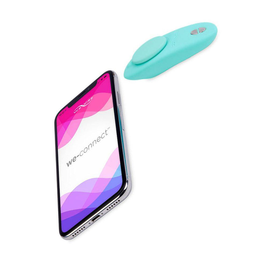 The We-Vibe Moxie+ Plus in Aqua is shown on a white background next to a cellular phone with the We-App displayed.