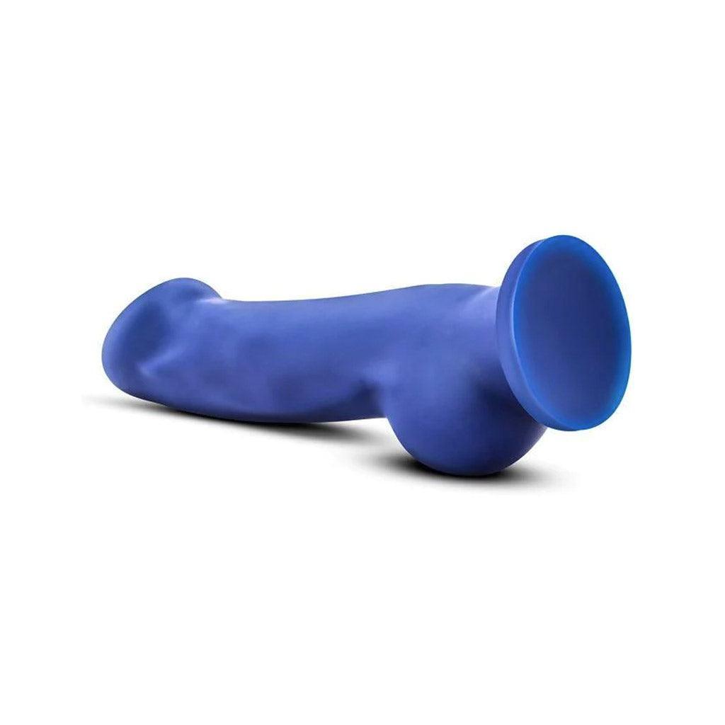 The Avant Ergo Dildo lying on a white surface and background, shown from the base to display the suction cup. 