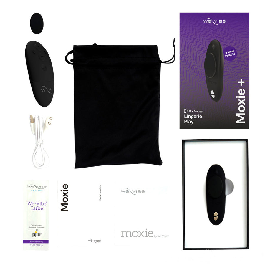 The We-Vibe Moxie+ Plus in Black is shown on a white background along with the accessories included: the manual, charging cord, and case.