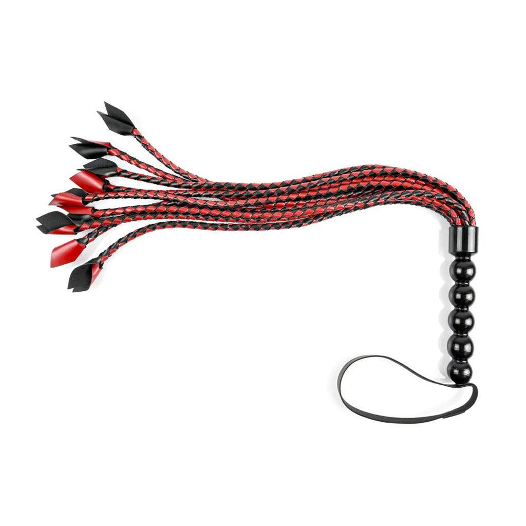 The Saffron Braided Flogger is shown against a blank background. It is a red and black BDSM impact play tool.
