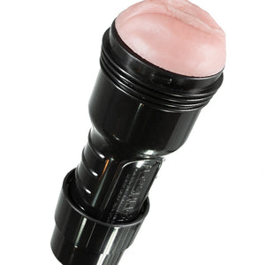 A Fleshlight that is compatible with The Fleshlight Stroker Rex Machine Adaptor is displayed against a blank background. The Fleshlight looks like a flashlight with a semi-realistic vulva at the opening end. 