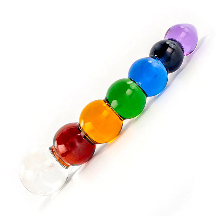 The Rainbow Bubble Glass Dildo With Dichroic Bulb is shown against a blank background. The dildo is made up of a series of stacked orbs, each one in a different color of the rainbow.