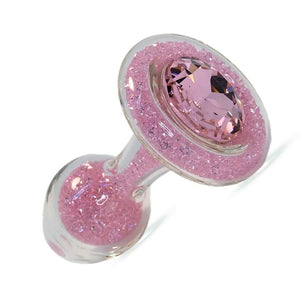 The Sparkle Glass Butt Plug With Crystal Base is shown in Pink against a blank background. The plug is filled with pink crystals and has one large, pink crystal covering the base.