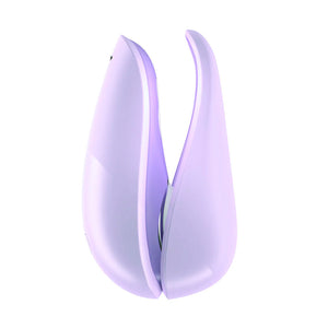 A Womanizer Liberty Clitoral Vibrator in Lilac is shown from the side with its case against a blank background.