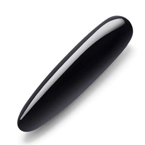 A Le Wand Crystal Slim Wand made of Black Obsidian is shown against a blank background. The toy is cylindrical and slightly tapered at one end.