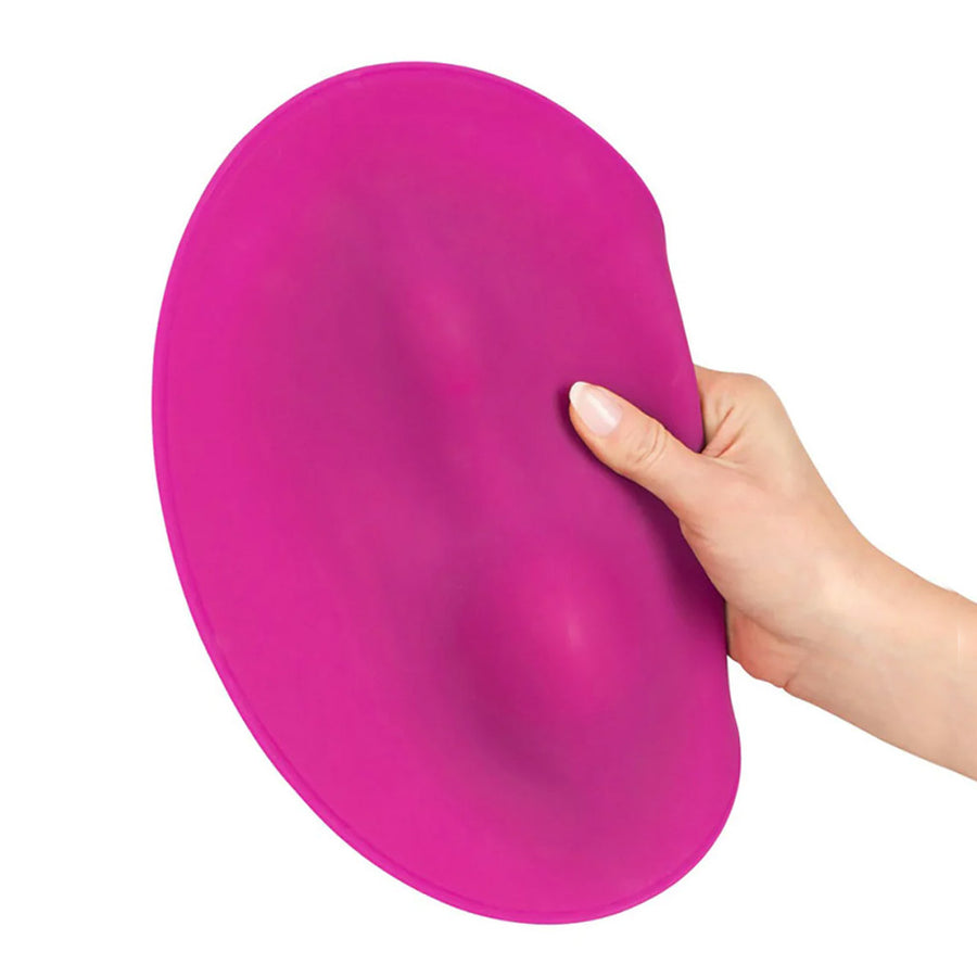 A hand is shown holding the Vibepad Remote Controlled Grinding Vibrator Pad against a blank background.