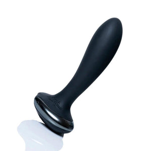 The Hot Octopuss Plex With Flex Vibrating Anal Butt Plug is shown against a blank background. The plug is made of black silicone. It is long and slim and somewhat tapered, with a thin neck and wide circular base.