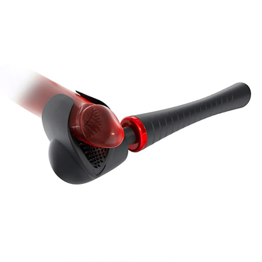 The Man Wand Xtreme Vibrating Penis Masturbator is shown against a blank background. A red dildo is shown going through the masturbator portion. The image of the dildo is translucent, showing the texture of the masturbator.