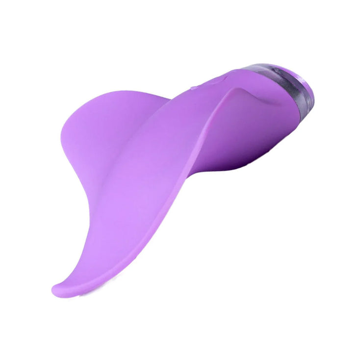 The Clandestine Mimic Massager External Vibrator in Lilac is shown against a blank background. The toy is shaped like a curved tongue with two wavy wings on the sides.
