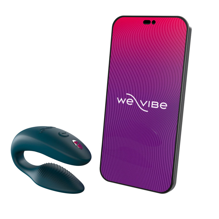 An image of the We-Vibe Sync 2 Couples Vibrator in the Green Velvet color on a plain white background. It is displayed next to a phone with the We-Vibe App displayed.