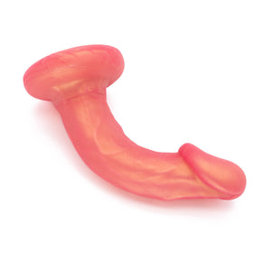  An image of the NYTC Shilo Posable Silicone Dildo in the Rose Gold color on a plain white background. The dildo is bent.
