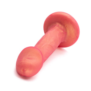  An image of the NYTC Shilo Posable Silicone Dildo in the Rose Gold color on a plain white background.