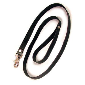 The black 4-foot Leather Leash is shown coiled up against a blank background. It is a strip of black leather with a wrist loop at one end and a metal snap hook at the other.