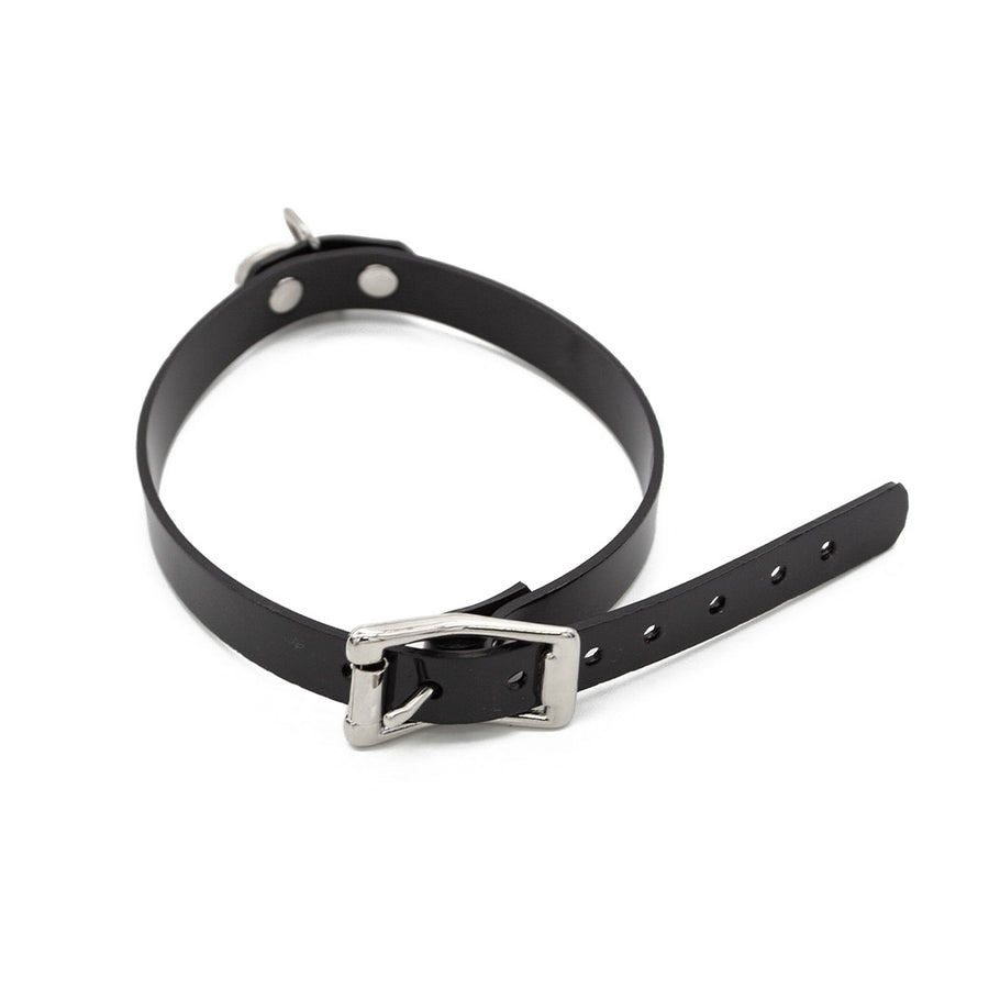 A buckled Stockroom Black PVC Choker with an O-Ring is shown against a blank background.