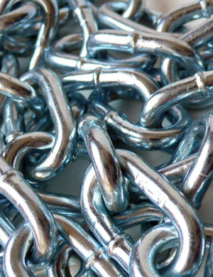 A close-up of a pile of Zinc-Plated Steel Chains is shown. The chains are silver. 