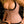 Load image into Gallery viewer, A close-up of a woman&#39;s torso in the pink leather Collette Corset is shown. The corset has metal clasps in the front and pushes up her breasts.
