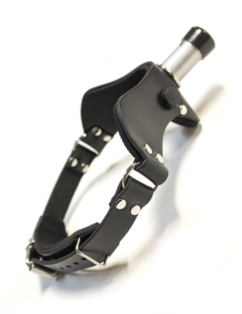 The “How May I Help You?” Gag, A.K.A the Humiliator Gag, is displayed against a blank background. The gag has an adjustable buckling strap with silver hardware. 