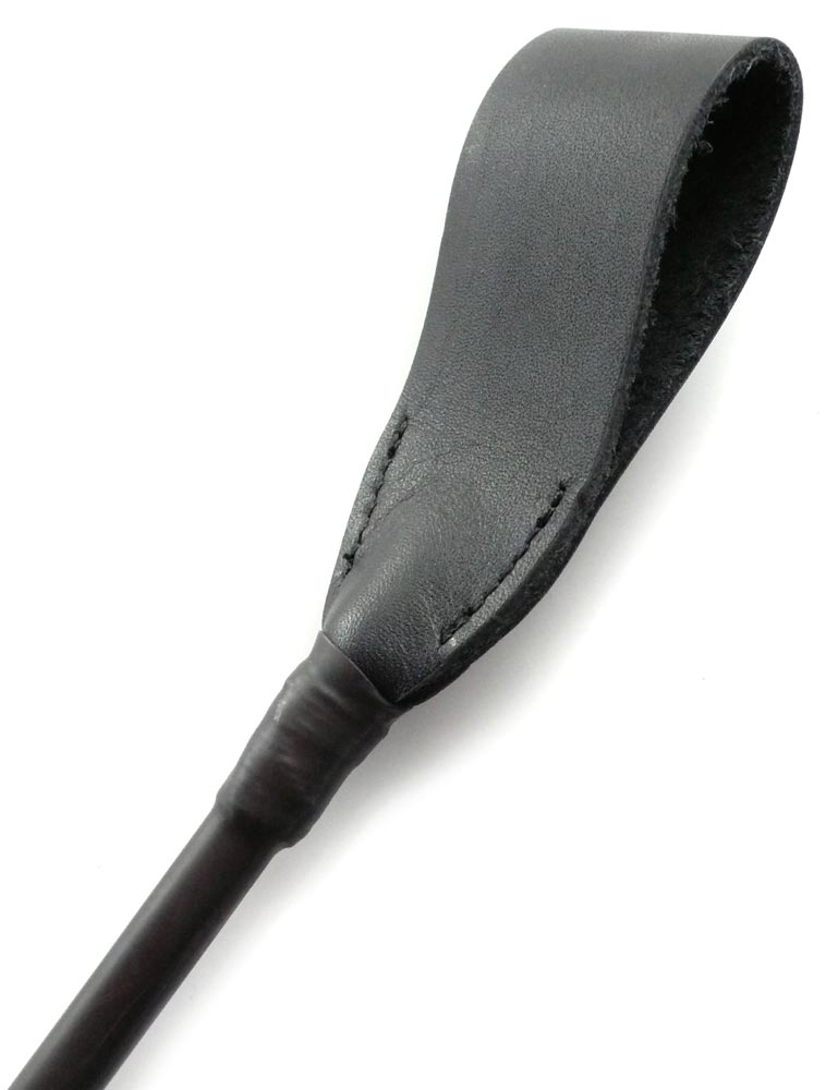 The black Flexicrop spanking implement is displayed against a blank background.