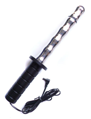 The Mystim Mighty Merlin Dagger-Dildo is displayed against a blank background. It is a thin, silver aluminum dildo with bumps running down it, and a large black handle.