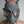 Load image into Gallery viewer, A close-up of a man with buzzed hair standing in front of a grey wall wearing the grey Finnish Military Gas Mask with the filters removed.

