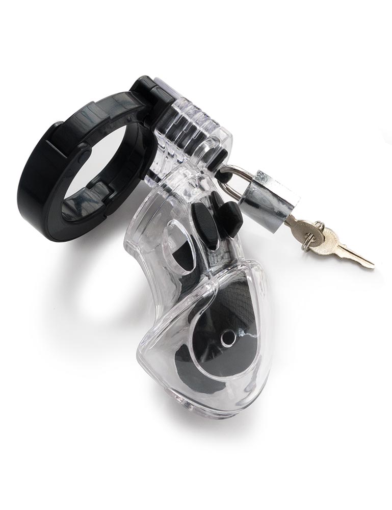The Mystim Pubic Enemy No. 1 Male Chastity Device is displayed against a blank background. It is a clear plastic cage shaped like a penis with black silicone lining. There is a small silver lock at the top with a brass key hanging out.