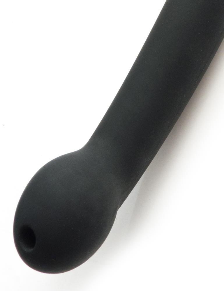 A close-up of the bottom of the handle of the Tantus Plunge Paddle is shown against a blank background. The handle has a curved, bulbous end, which has a small hole at the top. 