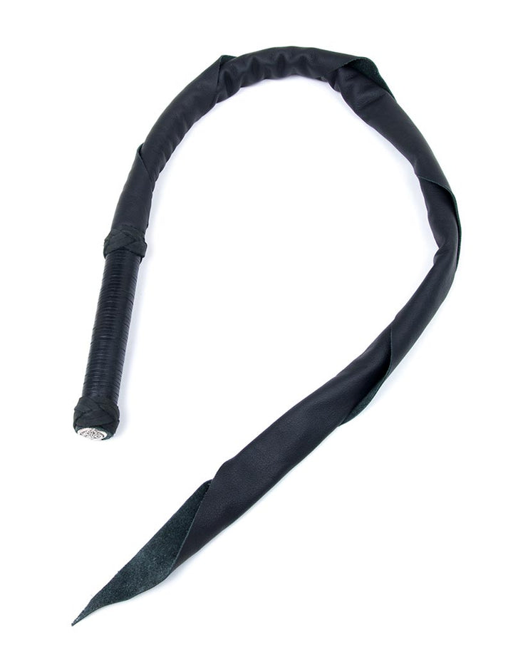 The Black leather Dragon Tail whip from Dragontailz is displayed against a blank background. The whip is a long, coiled piece of black leather ending in a point with a black leather-wrapped handle.